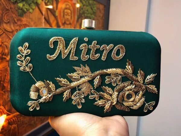 Customized embroidered bottle green silk clutch