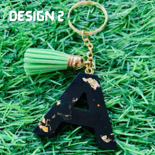 A Black Glitter Resin Initial Letter A-Z Keychain with Tassel